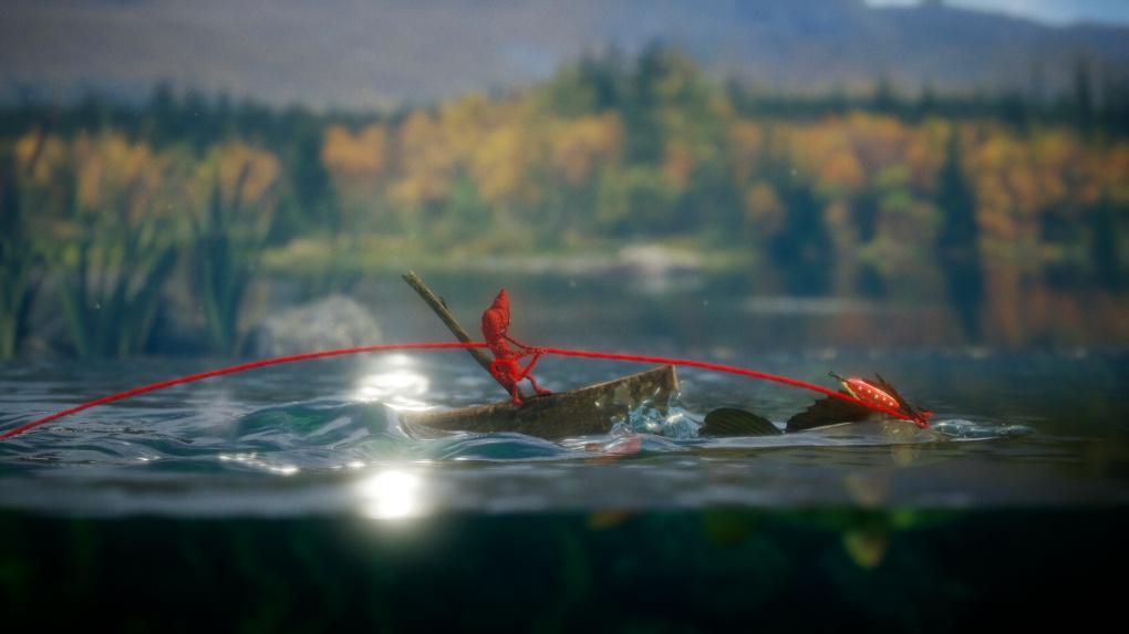 Unravel steckt voller hübscher Einfälle. Hier lassen wir uns von einem Fisch über einen Teich ziehen.