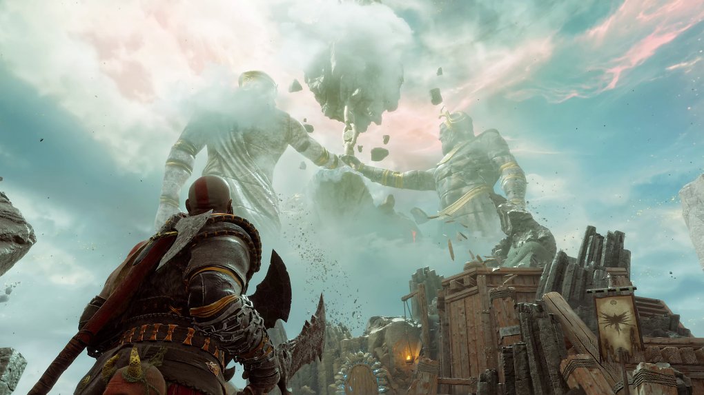 Kratos schaut in den Himmel von Valhalla, wo er zwei gigantische Statuen aus seiner griechischen Vergangenheit sieht.
