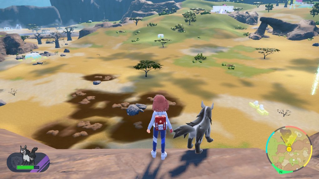 Die Hauptfigur und ein Fiffyen blicken auf die Landschaft.