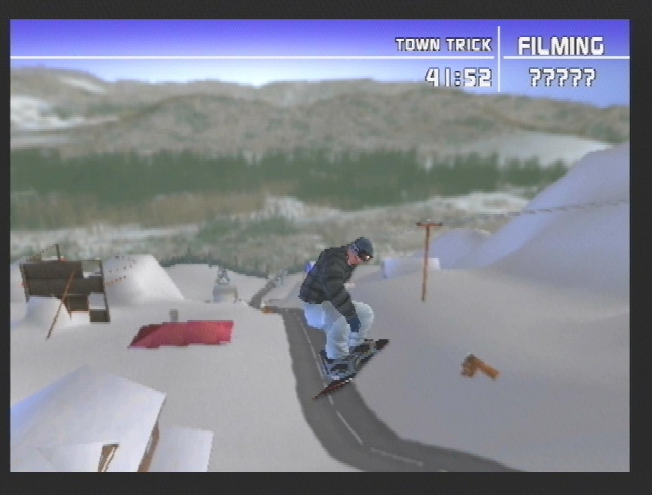 [26/11/2001] Dorfidyll: An verschiedenen Locations kann Ihr Snowboarder als Filmstar Geld verdienen.
