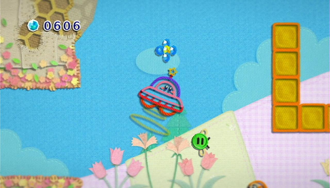 [16/06/2010] Am herausragensten an Kirby's Epic Yarn ist vermutlich der Grafikstil, denn in Patch Land besteht alles aus Stoff und Garn. Um zurück ins Dream Land zu gelangen, muss Kirby sieben magische Fäden finden. Dabei kann er unterschiedliche Formen annehmen.