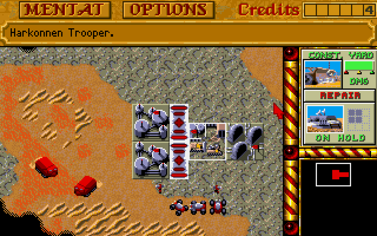 [03/09/2021] Vielfach kopiertes Konzept: Wer in Dune 2 – Kampf um Arakis (1992) Einheiten und Gebäude konstruieren will, muss Ernter losschicken (links im Bild), die eine wertvolle Ressource (hier Spice genannt) abbauen und zur Basis bringen, wo sie dann in Credits umgewandelt wird.
