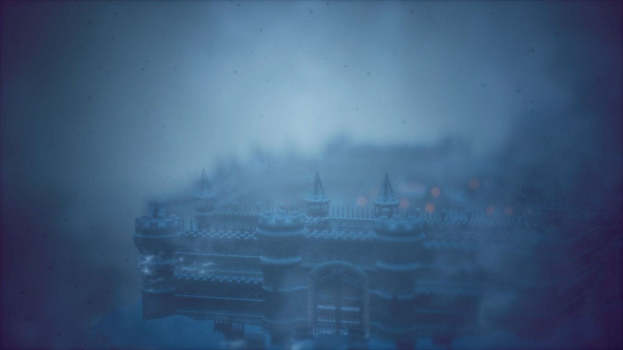 Octopath Traveler 2: Die Zinnen einer zugeschneiten Burg aus der Vogelperspektive.