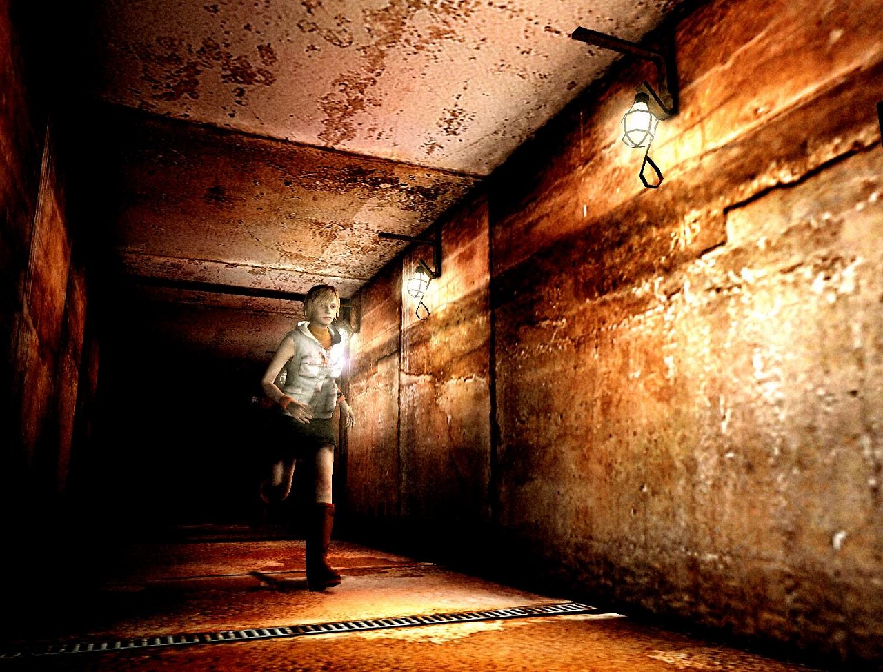 Heather Mason aus Silent Hill 3 läuft einen rostigen Gang entlang.