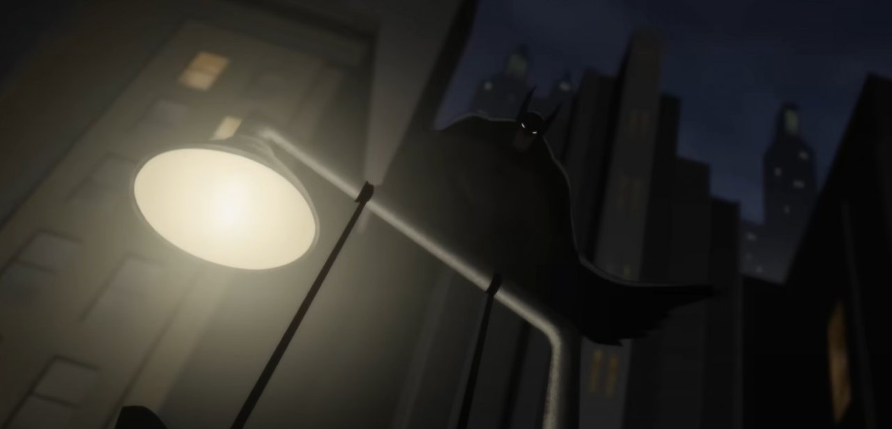 Batman hockt auf einer Laterne.
